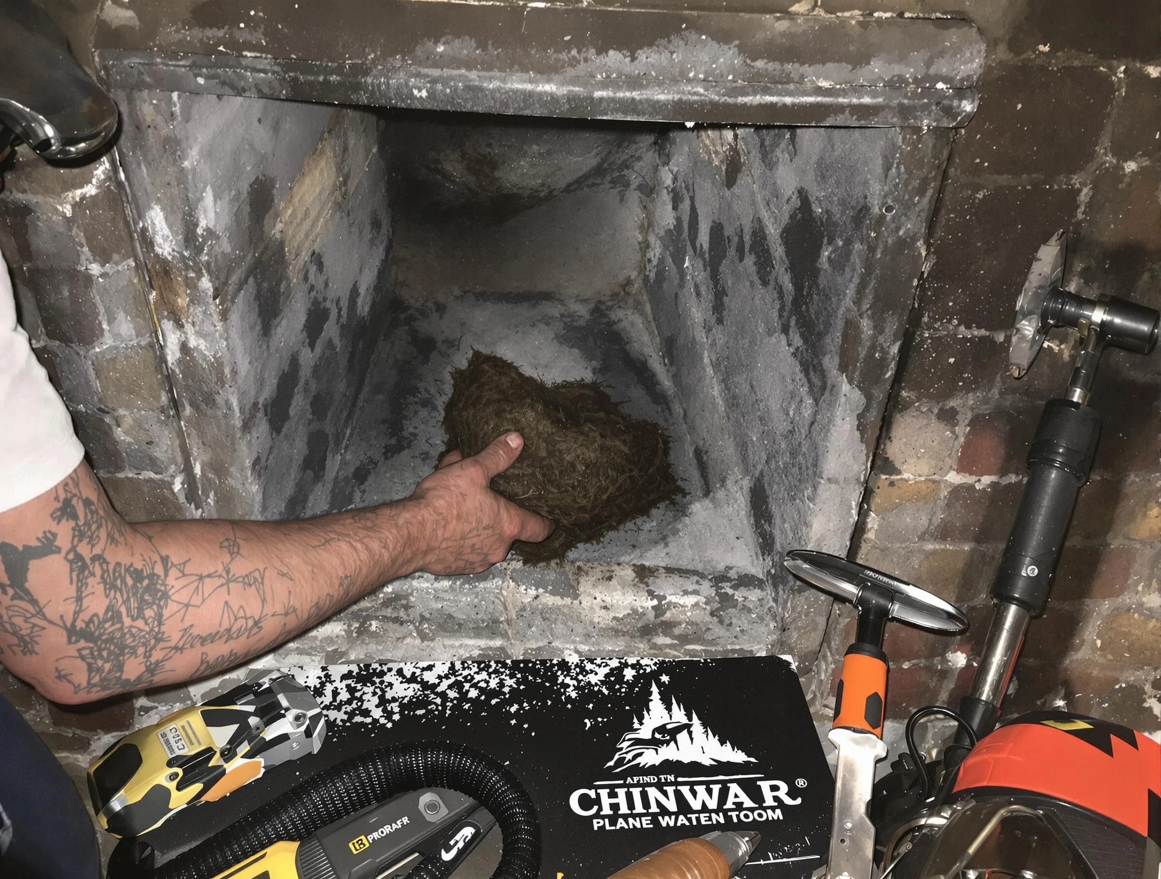 Reading Chimney Sweep safely removing debris and screening chimney in Reading, MA